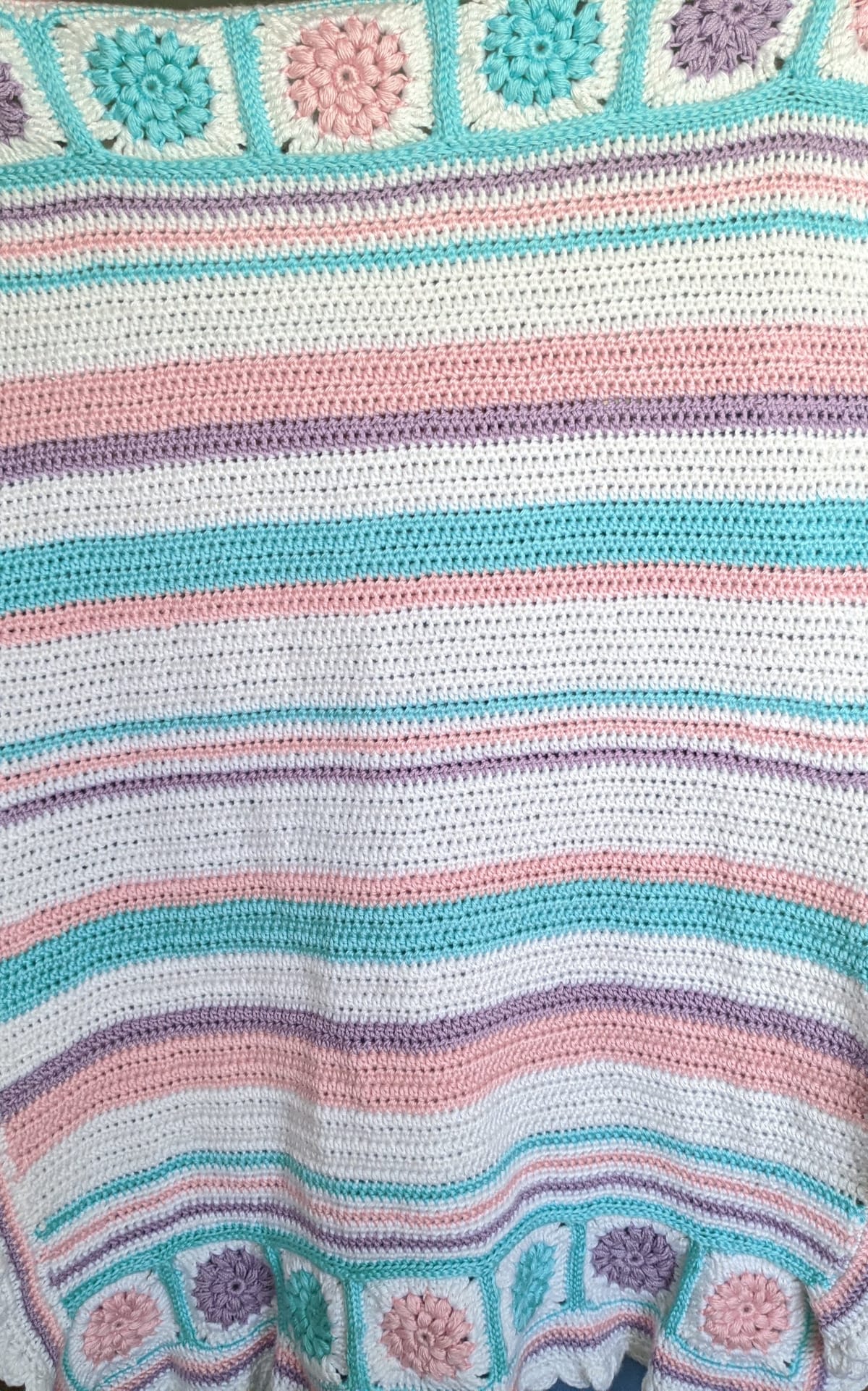 Striped crochet blanket in blue, pink, white and purple, for the blanket yarn calculator