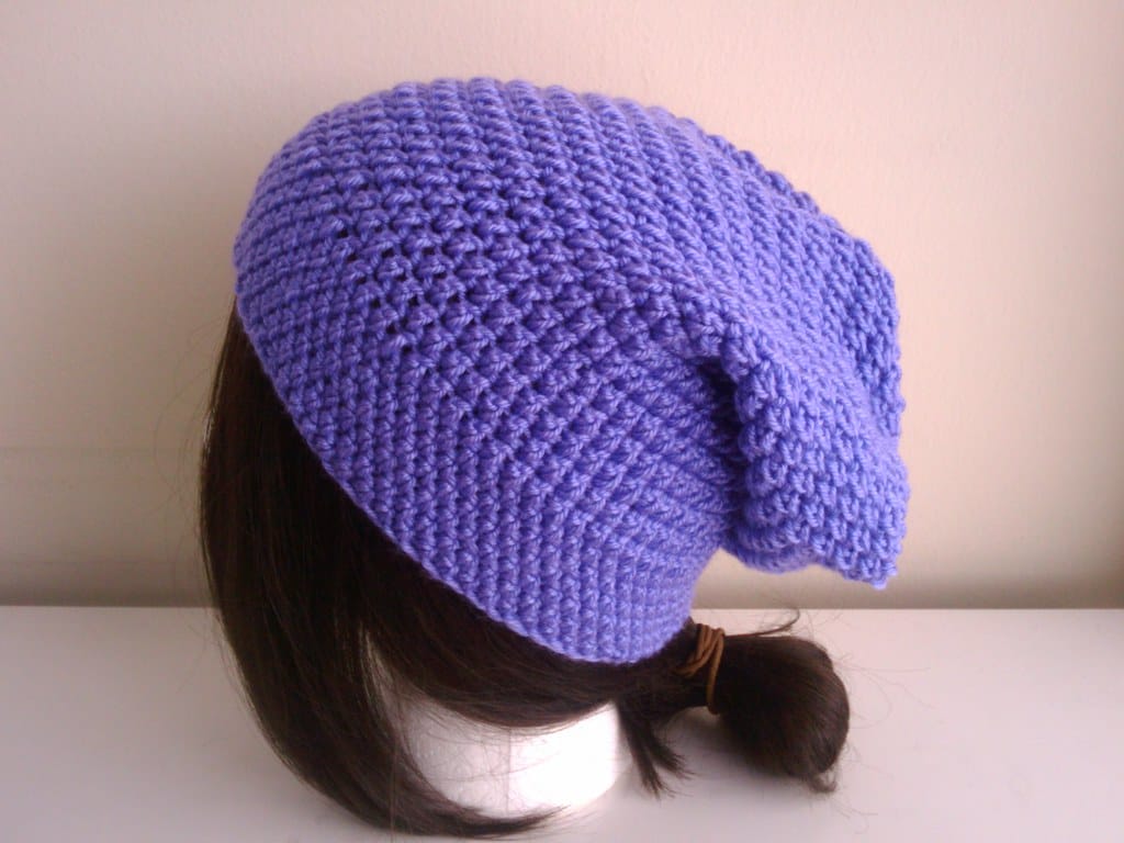Purple crochet slouch hat on a mannequin head, showing crochet hat sizing and fit